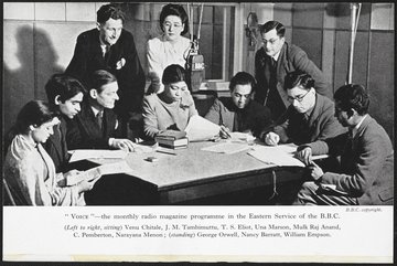 Group photograph of 'Voice' programme presenters and writers (Left to right) Venu Chitale, Meary James Tambimuttu, T. S. Eliot, Una Marson, Mulk Raj Anand, C. Pemberton, Narayana Menon; (standing) George Orwell, Nancy Barrat, and William Empson