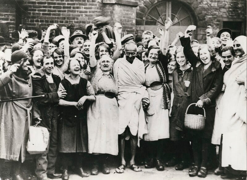 Photo of Gandhi and group of women