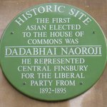 Green plaque commemorating the election of Dadabhai Naoroji to the House of Commons