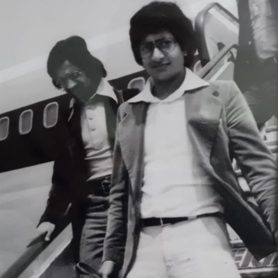 Vijay Parmar and friend disembarking a plane, 1976.