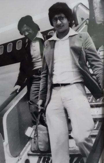 Vijay Parmar and friend disembarking a plane, 1976.