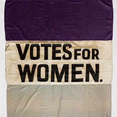 Suffragette banner, saying 'Votes for Women' in capital letters